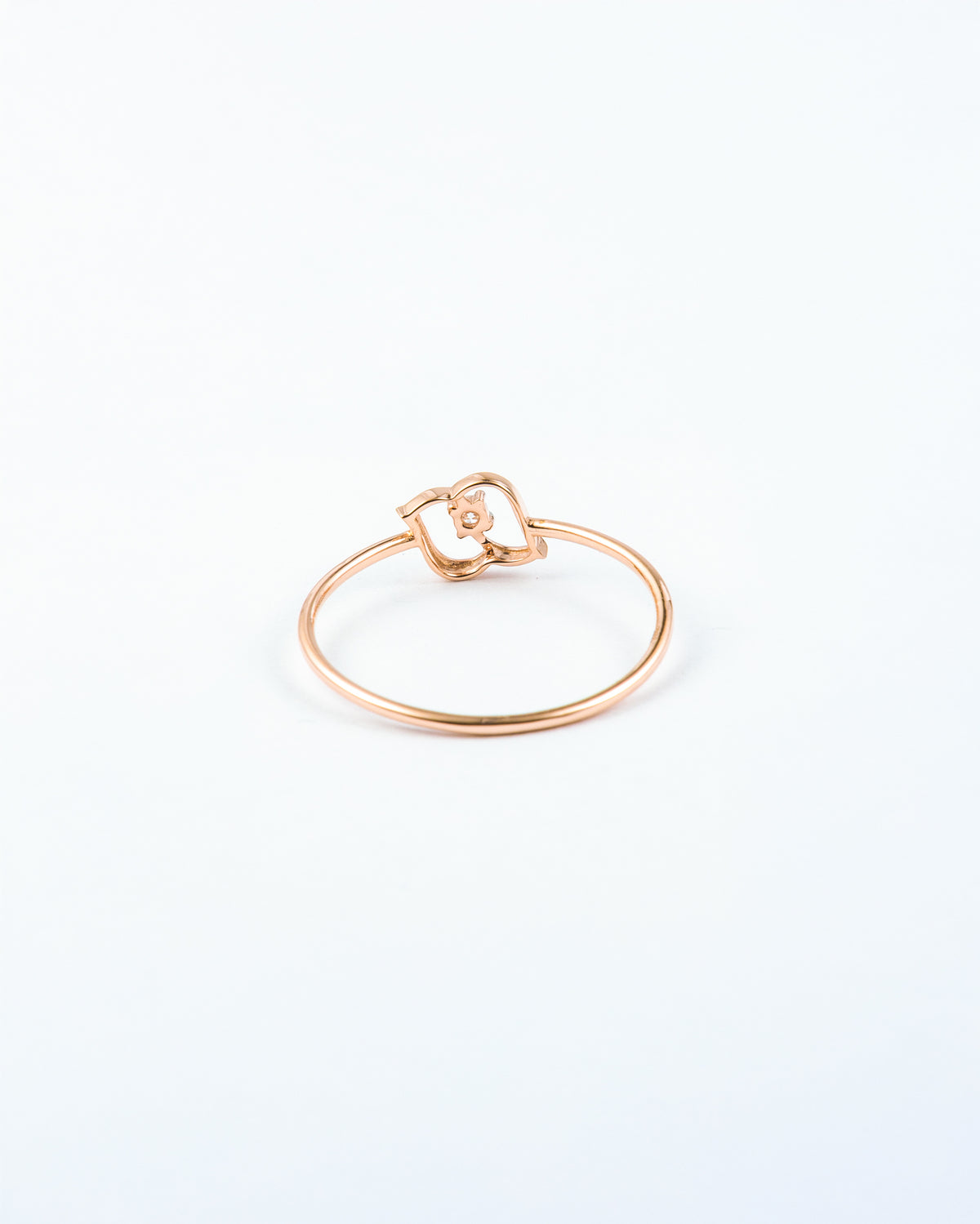 Rose Gold Diamond Solitaire Ring with Open Swirl Motif