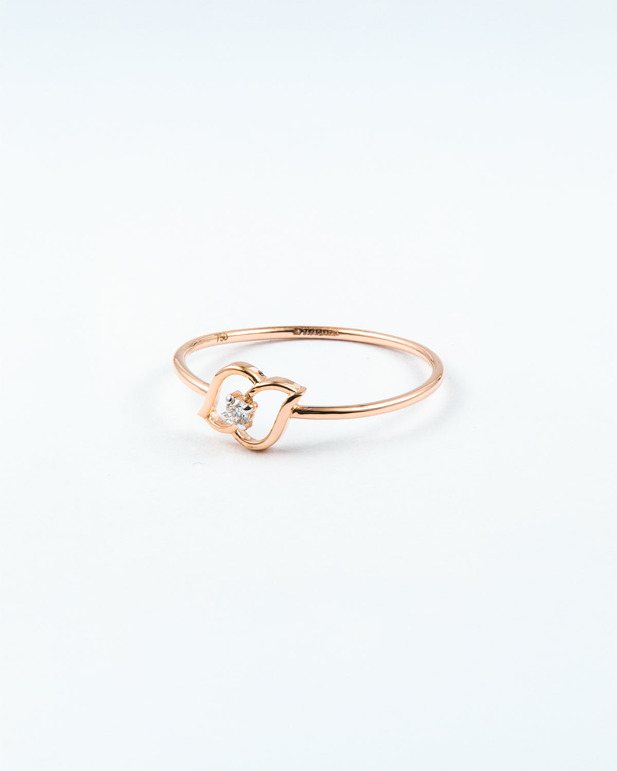 Rose Gold Diamond Solitaire Ring with Open Swirl Motif