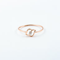 Rose Gold Diamond Solitaire Ring with Open Swirl Motif